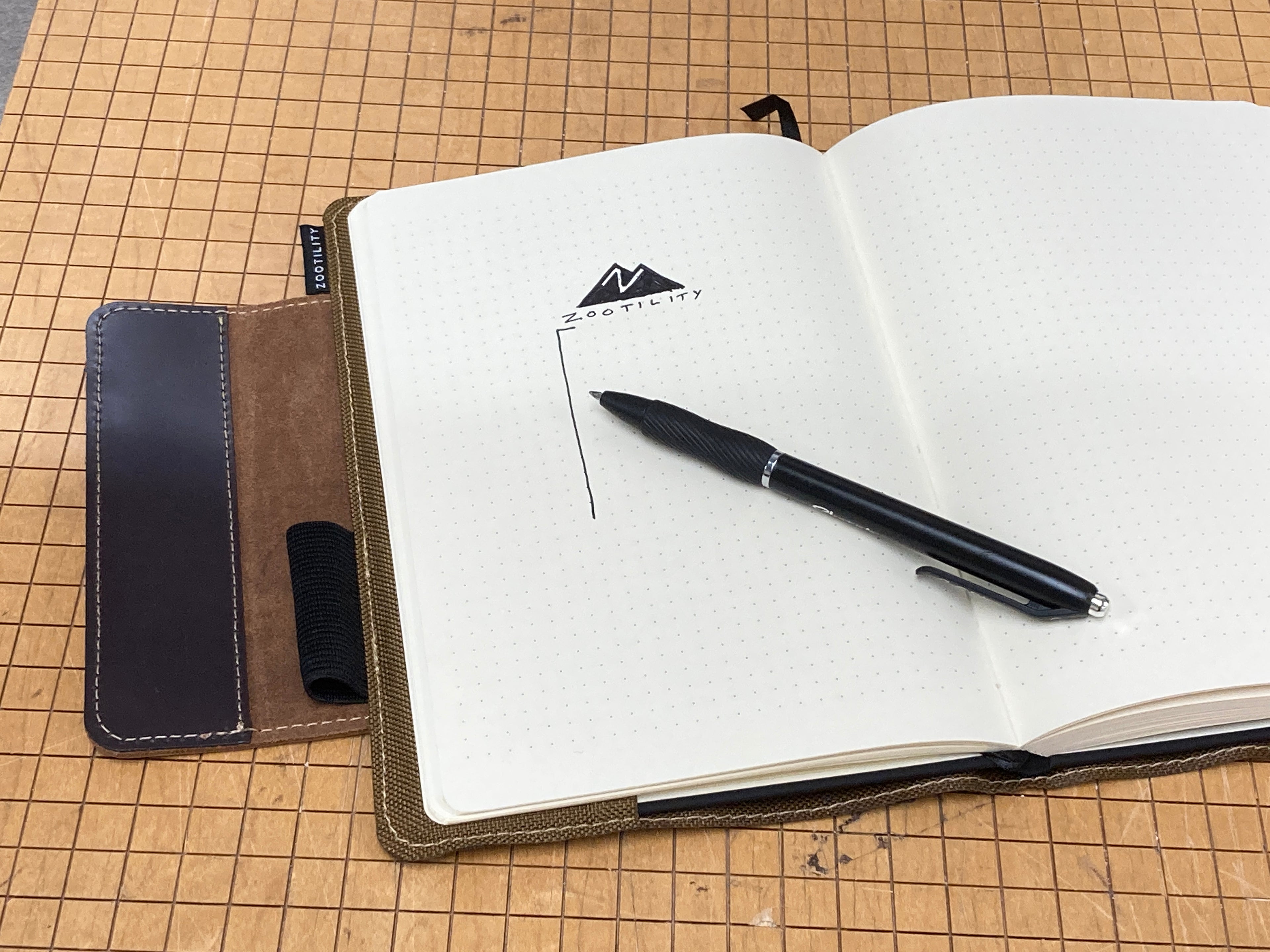 Notebook open with pen.
